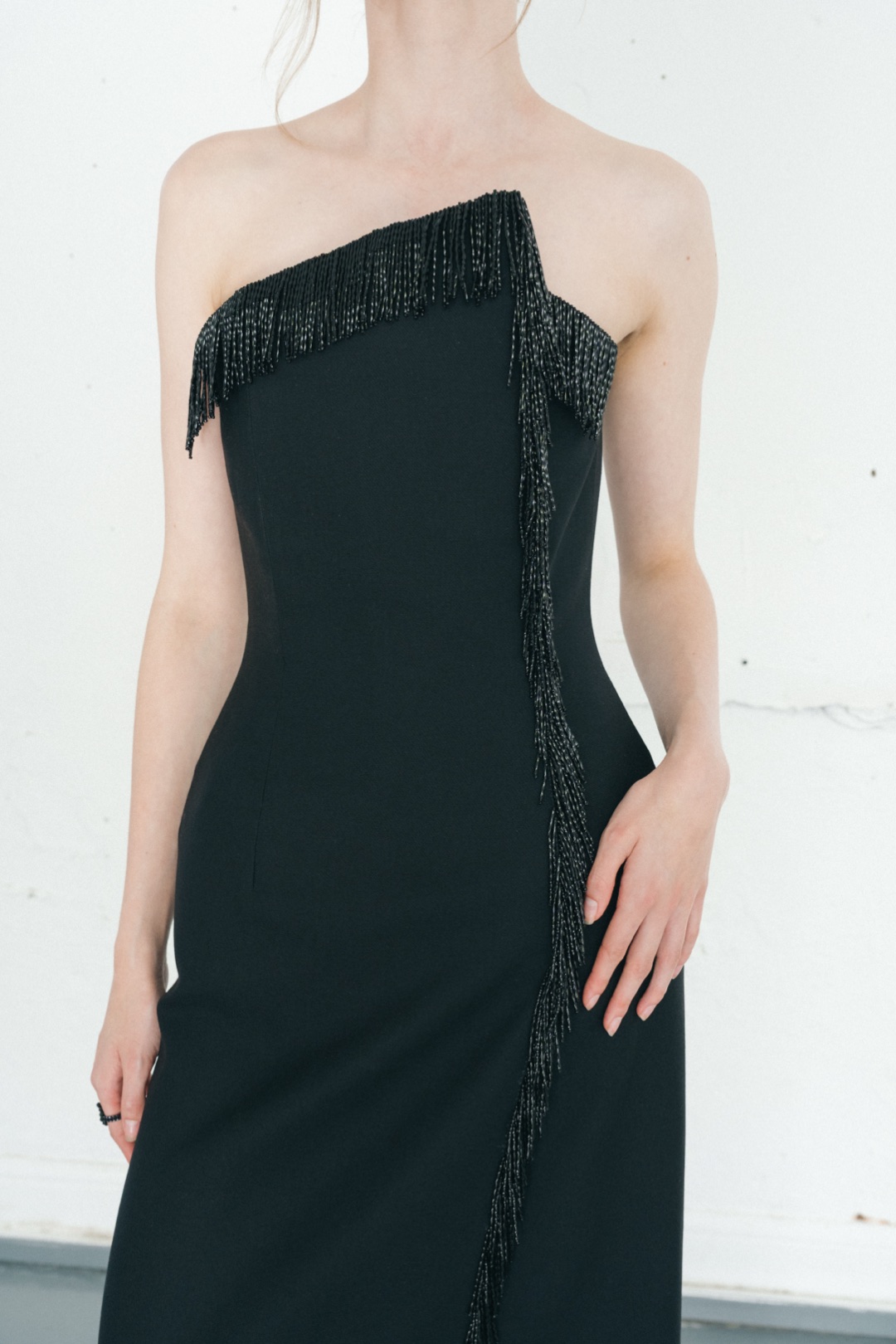 The fringe gown, close-up of the beaded fringe on the asymmetric neckline