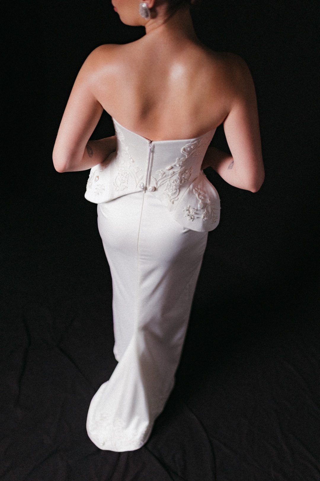 The embroidered peplum at the back